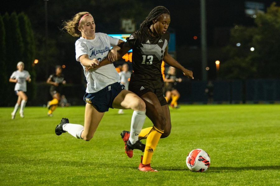 Maggie Starker (left) fights for the ball in Marquette women's soccer's 2-0 win over Western Michigan Sept. 15 at Valley Fields. 