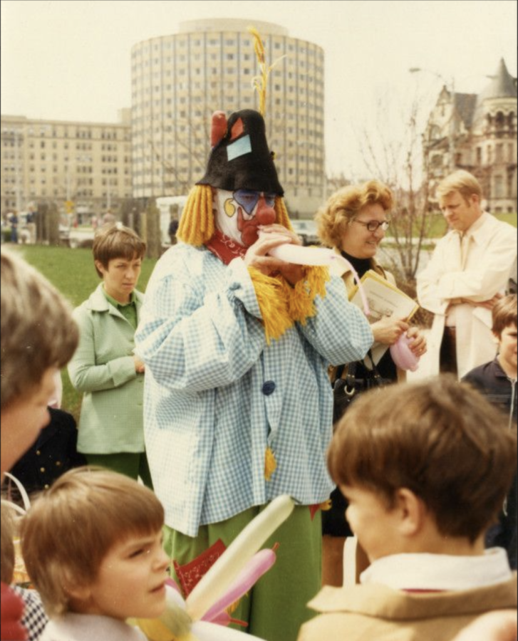 Often found dressed as "Tumbleweed the Clown" in a blue-and-white plaid shirt, white painted face and red nose, Naus would make balloons animals and tell jokes to the Marquette community. Photo courtesy of Marquette University Archives