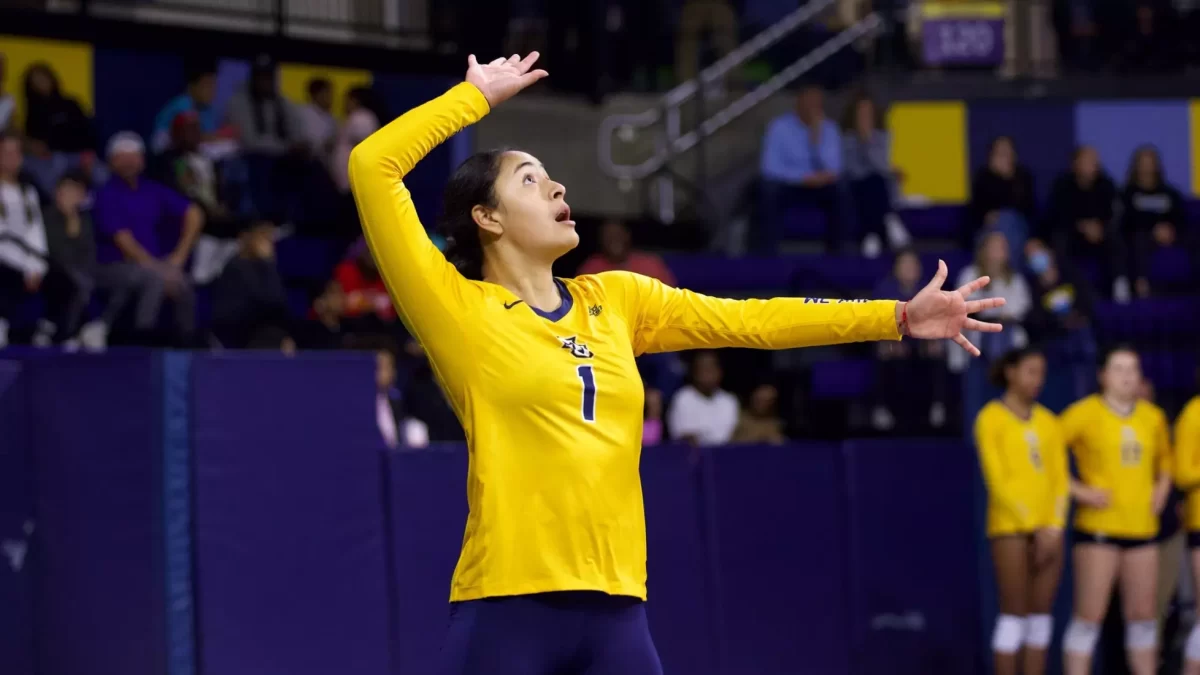 Yadhira Anchante serves the ball in Marquette volleyball's 3-0 sweep over St. John's. (Photo courtesy of Marquette Athletics.)