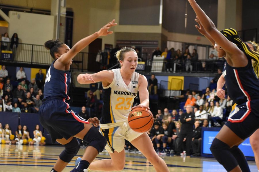 Jordan King drives to the hoop in Marquette's 59-52 upset win over UConn Feb. 9, 2023. 