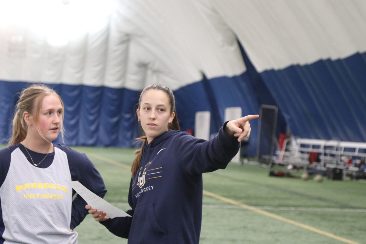 Kara Finneke (right) is the Marquette club field hockey president. 