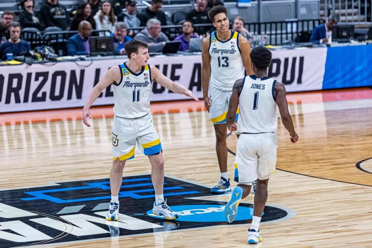 Marquette men's basketball celebrates in its 87-69 win over Western Kentucky. (Photo courtesy of Marquette Athletics.)